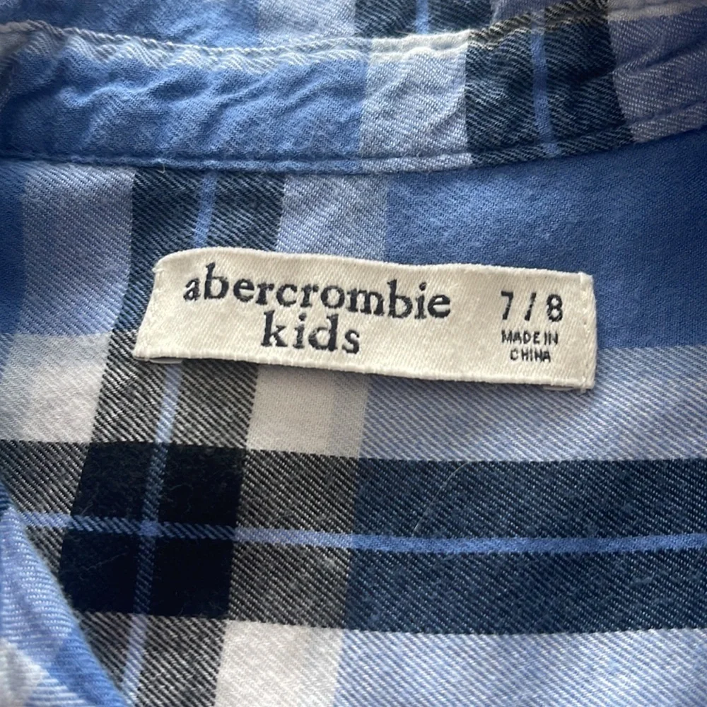 Abercrombie Kids plaid cotton flannel. Color- blue plaid. Size 7/8. Minor tear